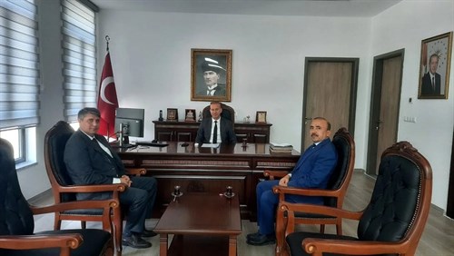 Muğla İl Nüfus ve Vatandaşlık Müdürü Utku Candan, İlçe Nüfus Müdürü Oğuzhan Okulu, Kaymakamımız Mustafa Maslak'ı ziyaret etti.